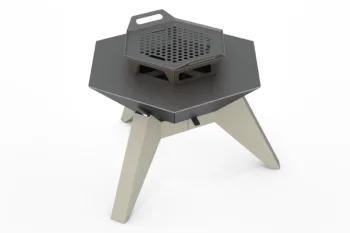 The Flamula 800 metal fire pit with a modern hexagonal design and orange legs is suitable for outdoor use.