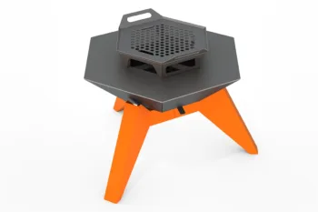 The Flamula 800 metal fire pit with a modern hexagonal design and orange legs is suitable for outdoor use.